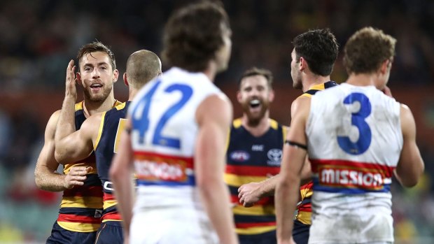 The Crows' Richard Douglas celebrates a goal in the huge win against the Western Bulldogs on Friday night. 