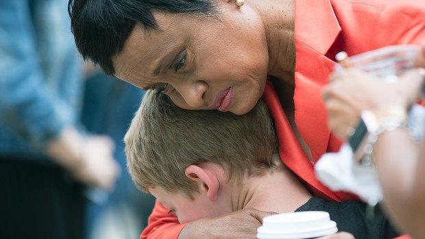 Judge Glenda Hatchett was hugged by Philando Castile supporter Guthrie Morgan, 7, after Jeronimo Yanez was found not guilty on all counts in the shooting death of Philander Castile.
