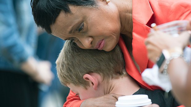 Judge Glenda Hatchett was hugged by Philando Castile supporter Guthrie Morgan, 7, after Jeronimo Yanez was found not guilty on all counts in the shooting death of Philander Castile.