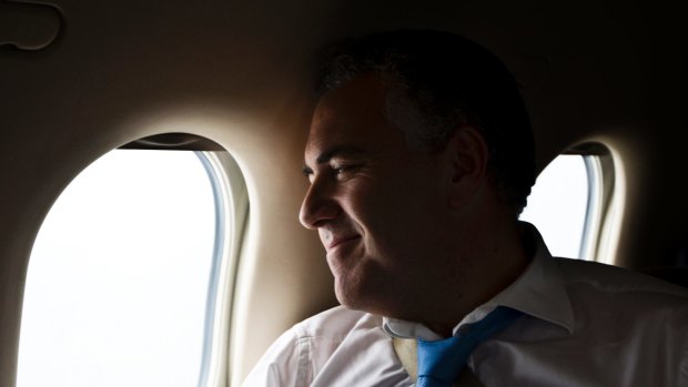 Treasurer Joe Hockey on board a private plane in 2013.