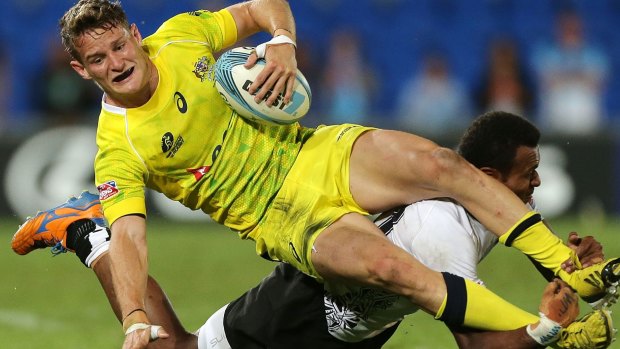 Con Foley of Australia is tackled by Sainivalati Ramuwai of Fiji during the Gold Coast Sevens in October.