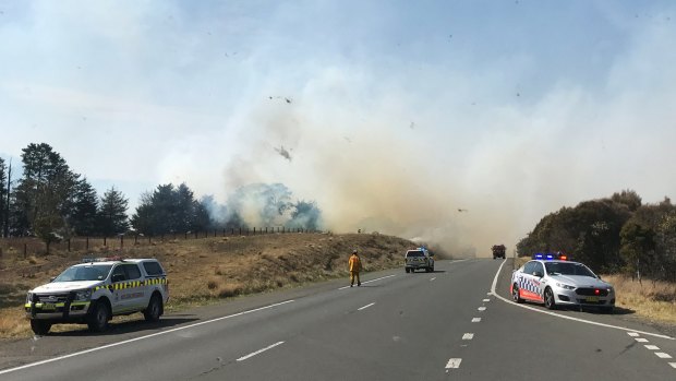 A grass fire is seen along the Hume Highway, north of Goulburn.