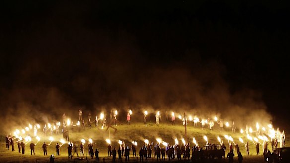 Members of the Ku Klux Klan participate in cross burnings after a "White Pride" rally in April.