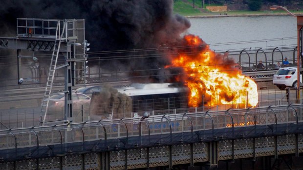 Fire engulfs the bus on the Sydney Harbour Bridge on Thursday night.
