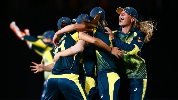 Captain Meg Lanning (right) celebrates with her team after winning the Ashes.