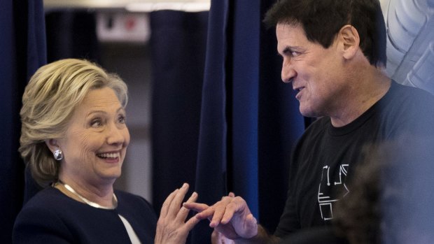Democratic presidential candidate Hillary Clinton chats with Dallas Mavericks basketball team owner, Pittsburgh native Mark Cuban.