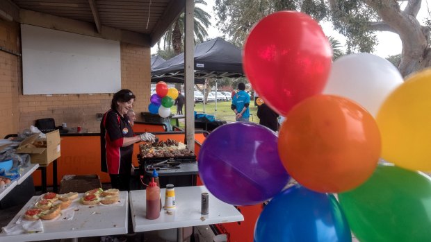 Even the barbecue was adorned with rainbow-hued balloons.