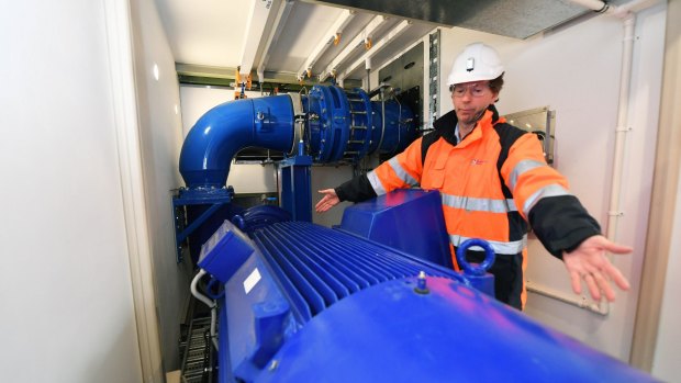 Ian Royston, from Melbourne Water, inspects the new ''mini-hydro'' plant at Dandenong North.