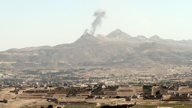 Smoke billows from military barracks in the Jabal al-Jumaima mountain following an air strike near Sanaa on Monday. 