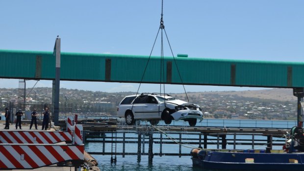 Damien Little's car is pulled from Port Lincoln harbour.