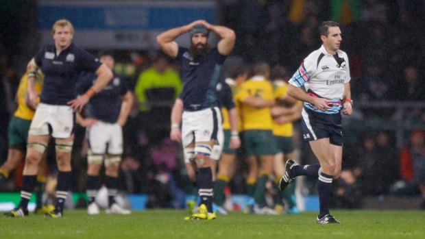 Quick exit: South African referee Craig Joubert runs off the field after blowing the final whistle.