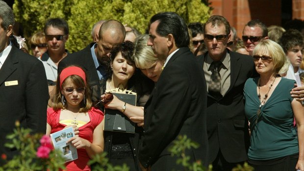 Stevie-Lee Weight's younger sister Monica-Rose pictured at her funeral in Mildura with her parents, Stephen and Jennie-May.