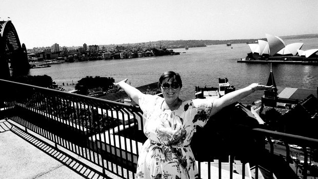 Mrs A. Gorrel admires the view from the 10th floor balcony of the new housing commission complex at The Rocks in Sydney, 19 March 1980. 