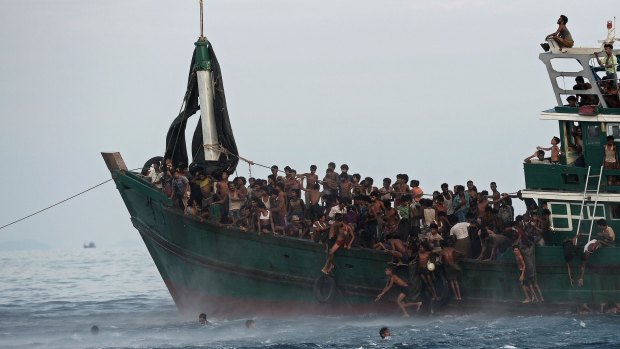 Rohingya migrants, whose plight illicited Tony Abbott's now infamous "Nope, nope, nope" response, aboard a boat in Thai waters.