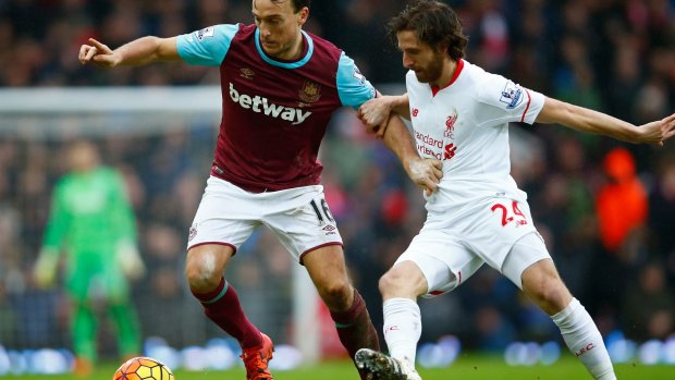 West Ham's Mark Noble and Joe Allen of Liverpool compete for the ball.