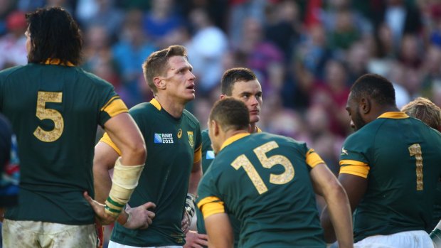 Devastated: South African captain Jean de Villiers, centre, and his players. 