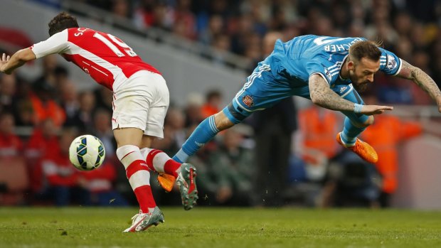 Sunderland's Steven Fletcher has a shot stopped by Arsenal's Santi Cazorla.