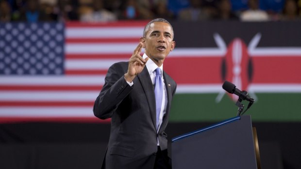 President Barack Obama delivers a speech, in front of American and Kenyan flags, in Nairobi, Kenya.