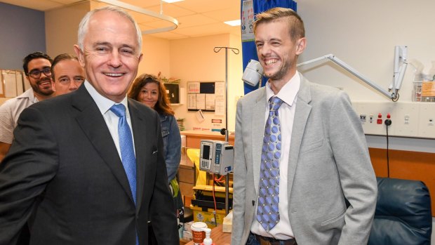 Prime Minister Malcolm Turnbull with transplant patient Cody Sheehan at Sydney's St Vincent's Hospital. His post-budget poll bounce has not materialised.