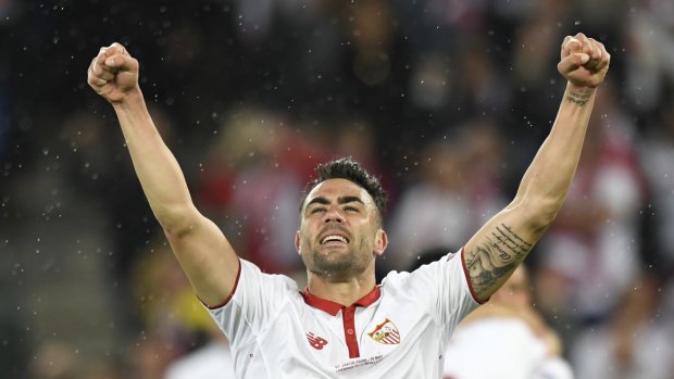Sevilla's Vicente Iborra celebrates after the final whistle.