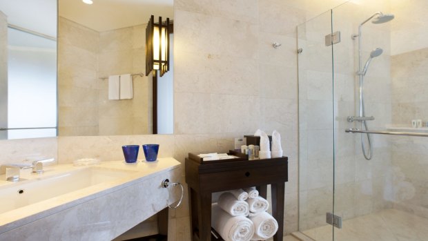 Family adventure suites at the Holiday Inn Resort Bali Benoa have a separate bathroom with rubber duck shower head and children's toiletries.