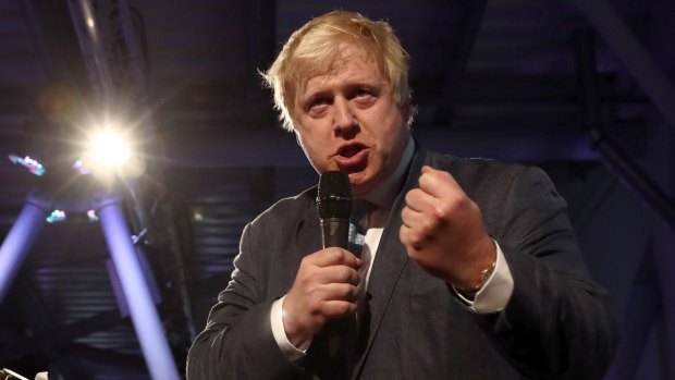 Conservative MP Boris Johnson talks to supporters during a Vote Leave rally.