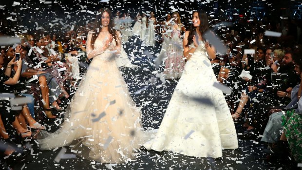 Jesinta Franklin (left) and Jessica Gomes (right) showcase designs during the finale on the runway at the David Jones event.
