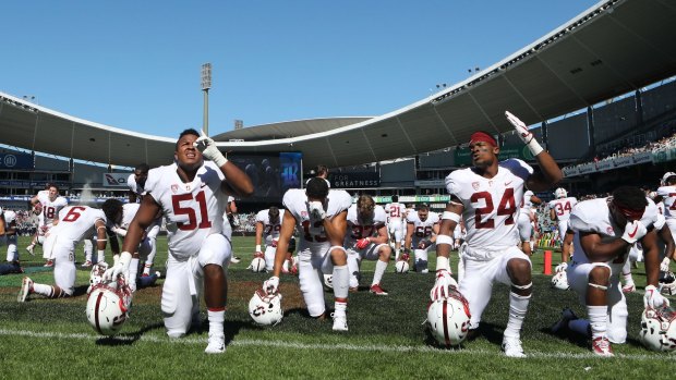 Strength and honour: Stanford Cardinal players Jovan Swann and Quenton Meeks prepare for the start of the NFL College Football Sydney Cup at Allianz Stadium.