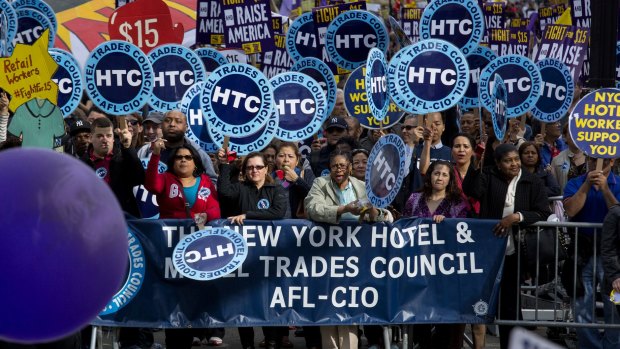 Protestors gather near Columbus Circle as fast food workers and union members call for a $US15 minimum wage in New York.