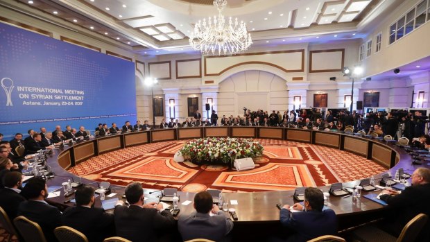 Delegations of Russia, Iran and Turkey hold talks on Syrian peace at a hotel in Astana, Kazakhstan.