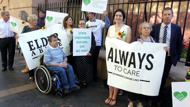 Campaigners gather outside Parliament on Thursday ahead of the debate on a bill to allow terminally ill patients over 25 to end their own lives in the Upper House.