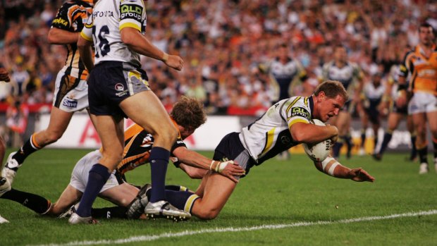 Still painful: Then-captain Travis Norton scores for the Cowboys during their grand final loss to Wests Tigers in 2005.