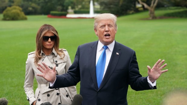 US President Donald Trump talks to reporters shortly after he announced that he would not certify Iran's compliance with the nuclear deal between Tehran and six world powers.