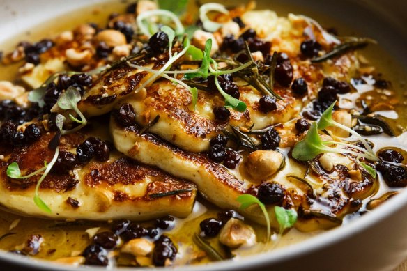 Grilled halloumi with honey, hazelnuts and currants.