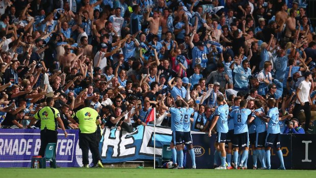 Who run's this town?: Sydney FC players celebrate with fans after winning the Sydney Derby.