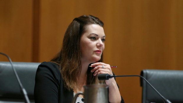 Senator Sarah Hanson-Young was accused of "peddling lies" by chair of the committee, Senator Ian Macdonald. She replied: "You are a joke."