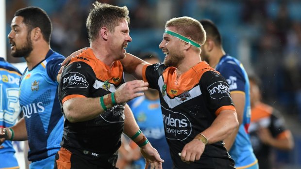 Record equalling moment: Chris Lawrence, left, is congratulated by Matt McIlwrick after his try.