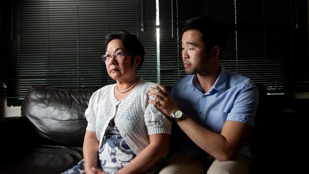 Hong Vo, mother of 22-year-old former Melbourne High student Martin Vo who took his own life last year, with her older son Daniel.