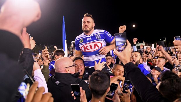 Emotional farewell: Josh Reynolds is chaired from the field following his final game at Belmore.