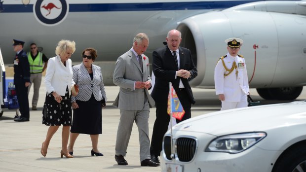 Their royal highnesses arrive at RAAF Base Edinburgh, South Australia. Prince Charles and General-General Sir Peter Cosgrove speak as do their wives Camilla Duchess of Cornwall and Lady Cosgrove. 