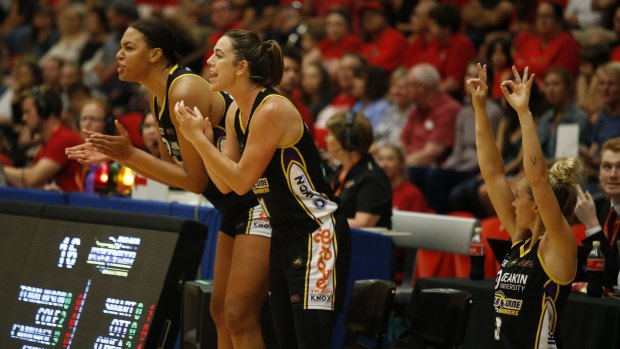 Cheer squad: Melbourne Boomers (from left) Liz Cambage, Jenna O'Hea and Brittany Smart in support from the sidelines on Friday night. 