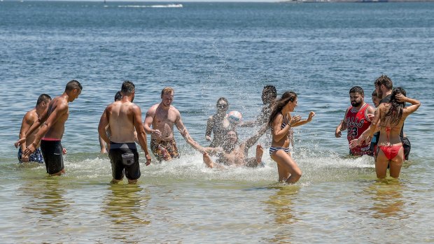People flock to beaches to cool down after a burst of hot weather in Melbourne.