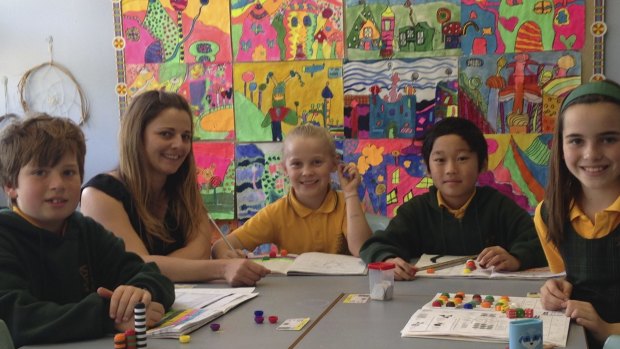 Think positive: Skye Migan with some of her students at Curl Curl North Public School.