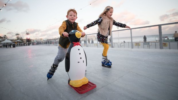 Harry Spencer-Gibson and his sister Kitty skate at Bondi Winter Wonderland outdoor ice rink