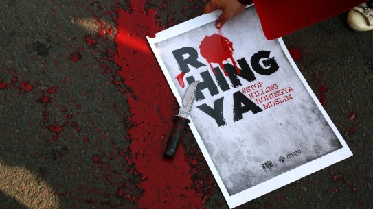 A poster with fake blood after a theatrical performance in Jakarta on Sunday depicting the violence against Muslim Rohingya in Myanmar.