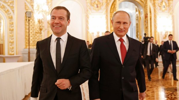 Russian President Vladimir Putin, right, and PM Dmitry Medvedev after Putin's state-of-the-nation address when Putin hoped for mending a rift with the US and pooling efforts in fighting terrorism.