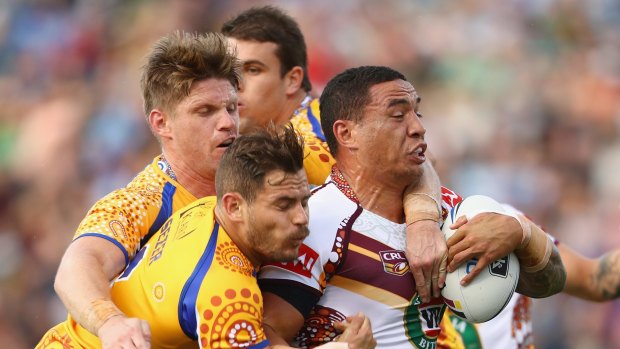 Held back: Tyson Frizell of Country is tackled by Chris Lawrence and Aidan Sezer.