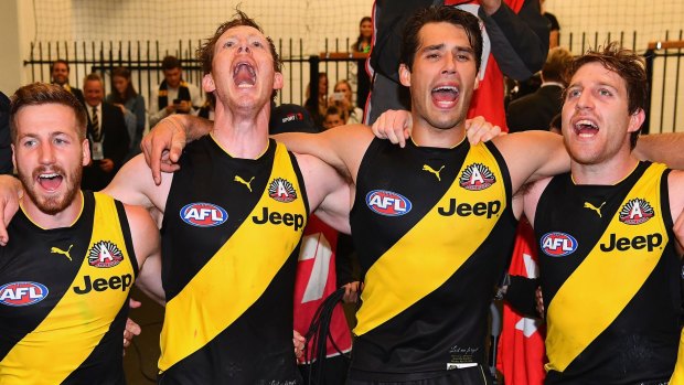  Kane Lambert, Jack Riewoldt, Alex Rance  of the Tigers sing the song in the rooms after winning the round five AFL match between the Richmond Tigers and the Melbourne Demons at Melbourne Cricket Ground on April 24, 2017 in Melbourne, Australia. (Photo by Quinn Rooney/Getty Images)