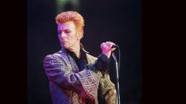 FILE - In this Jan. 9, 1997, file photo, David Bowie performs during a concert celebrating his 50th birthday, at Madison Square Garden in New York. Bowie, the innovative and iconic singer whose illustrious career lasted five decades, died Monday, Jan. 11, 2016, after battling cancer for 18 months. He was 69. (AP Photo/Ron Frehm, File)