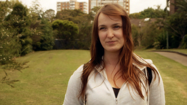 April  McKillop reaches for the headphones.